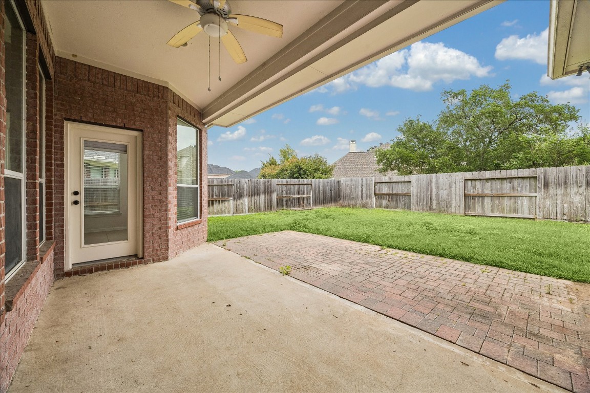 12507 Aliso Bend Lane Houston, TX 77041 - Photo 23 of 25 a view of a house with a big yard and large tree