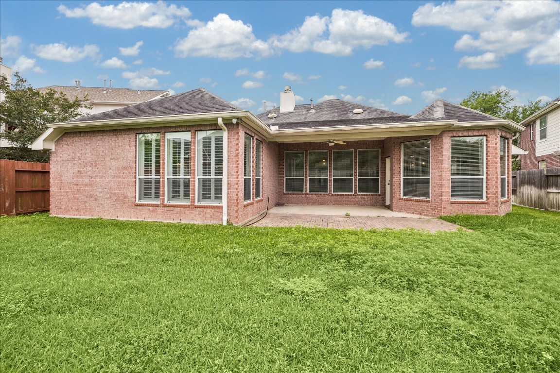 12507 Aliso Bend Lane Houston, TX 77041 - Photo 24 of 25 a front view of a house with a garden