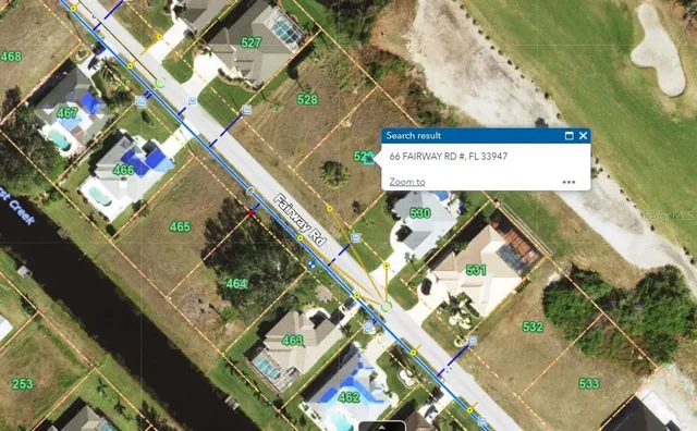 a picture of a room with a white wall and a refrigerator