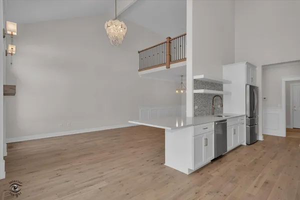 a kitchen with stainless steel appliances granite countertop a stove and a refrigerator