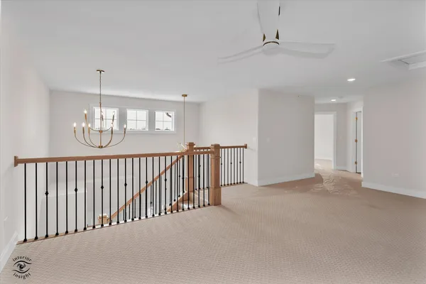 a view of a hallway with windows