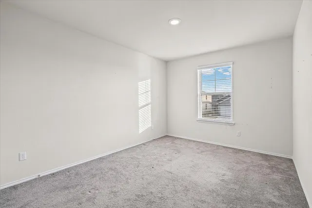 a bathroom with double sink and a mirror