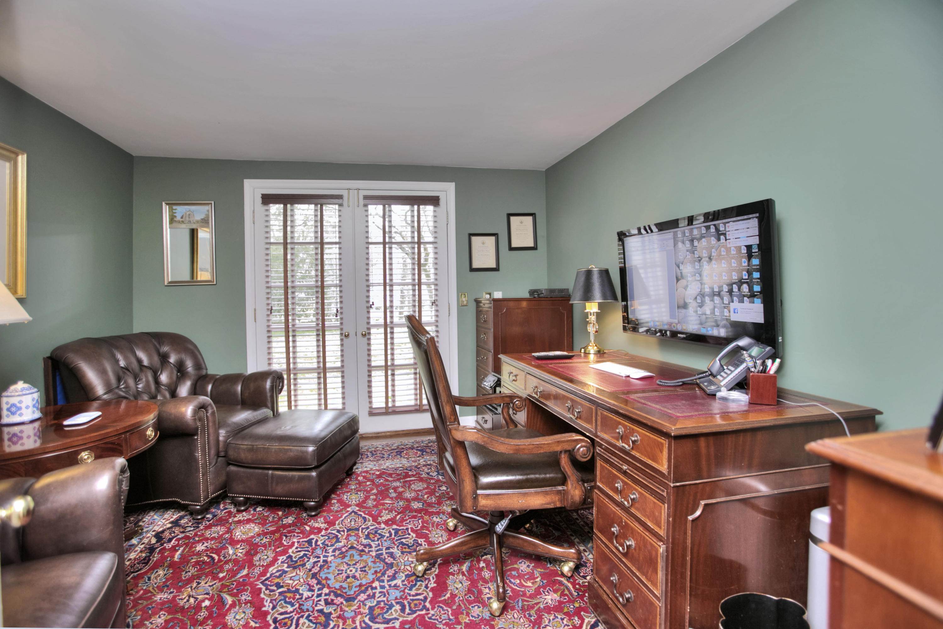 29 Stony Brook Road Darien, CT 06820 - Photo 13 of 24 a living room with furniture and a floor to ceiling window