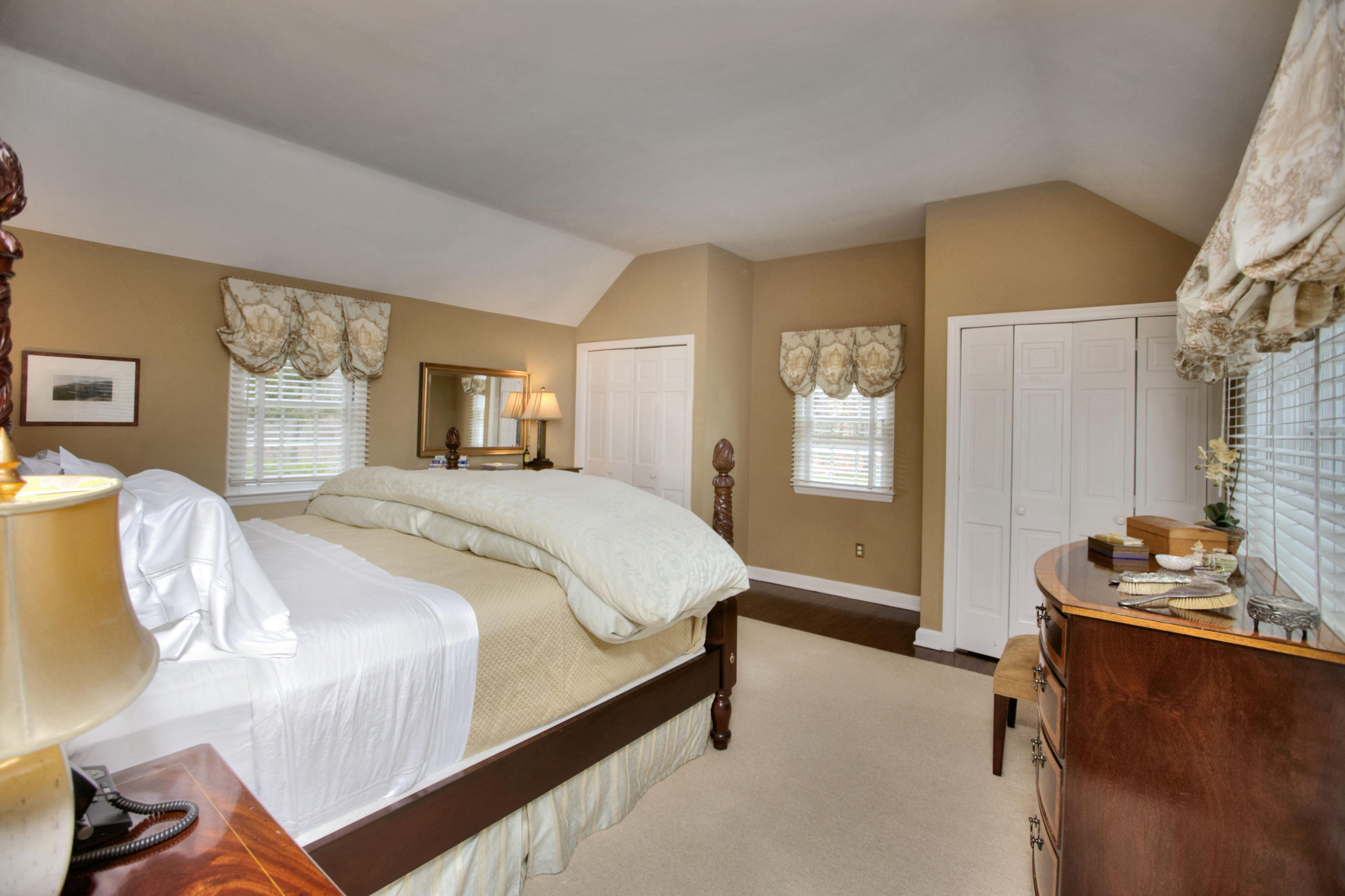 29 Stony Brook Road Darien, CT 06820 - Photo 14 of 24 a bedroom with a bed and wooden floor