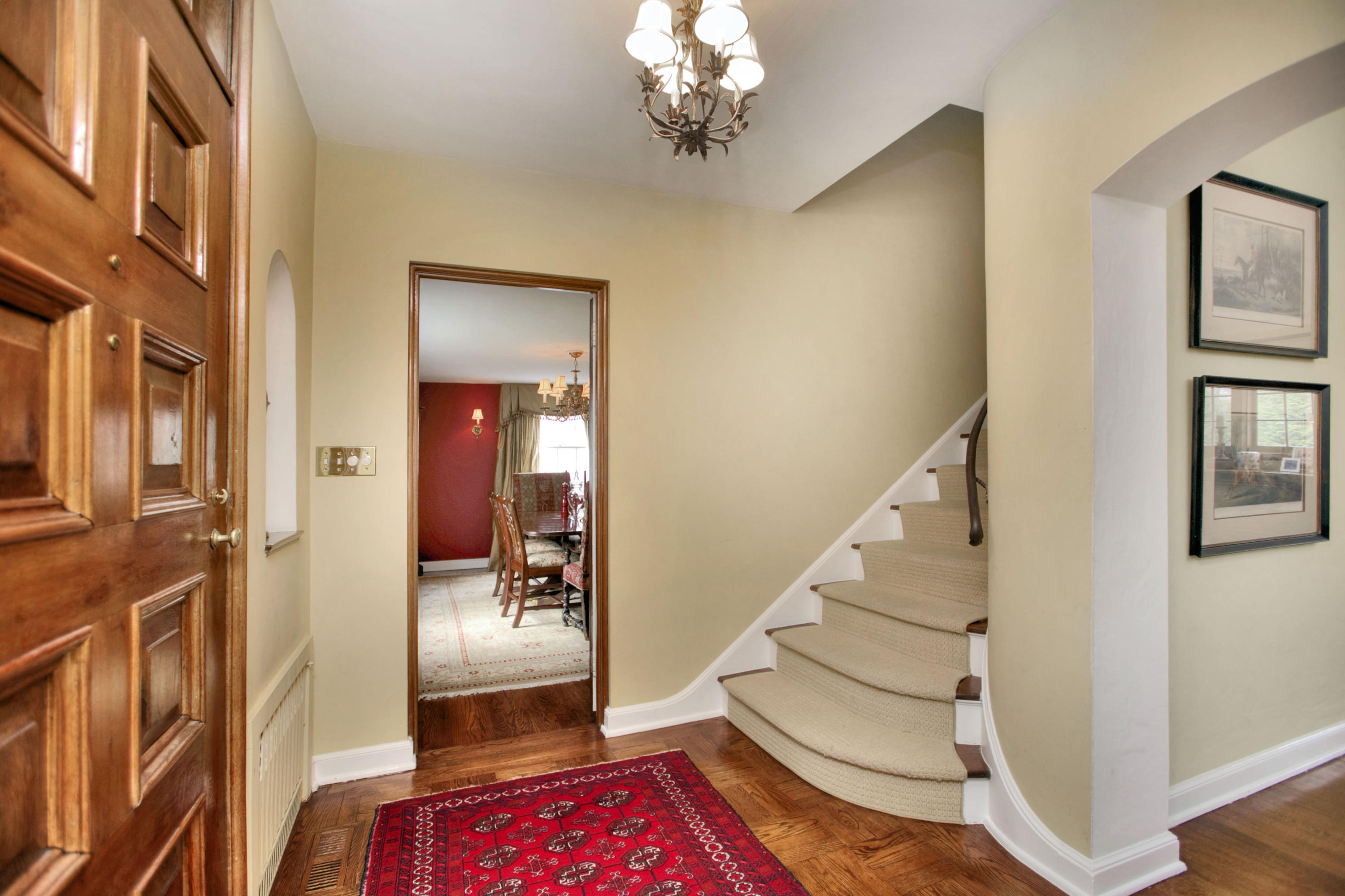 29 Stony Brook Road Darien, CT 06820 - Photo 16 of 24 a view of an entryway with wooden floor and a chandelier