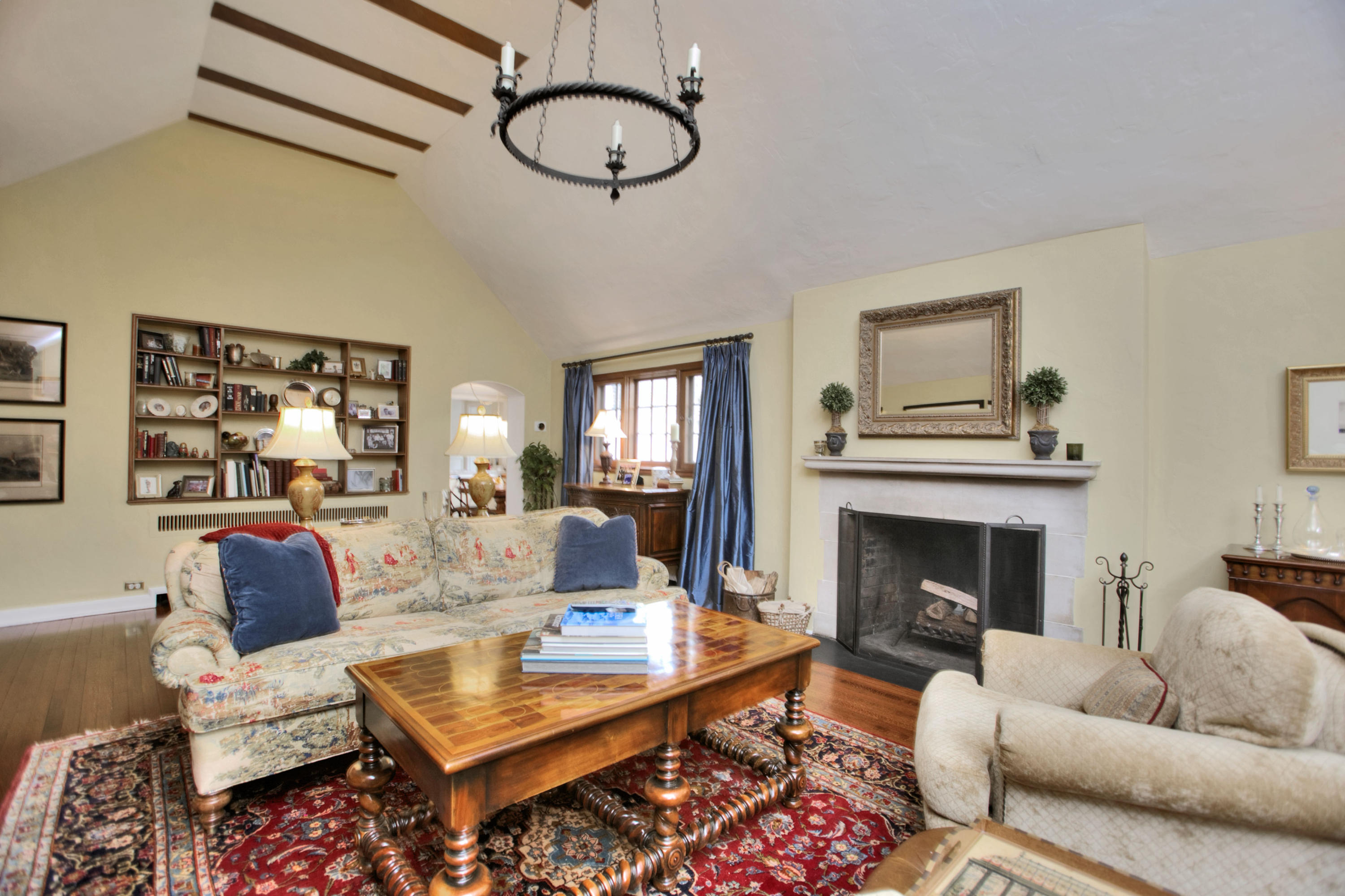 29 Stony Brook Road Darien, CT 06820 - Photo 6 of 24 a living room with furniture a rug and a fireplace