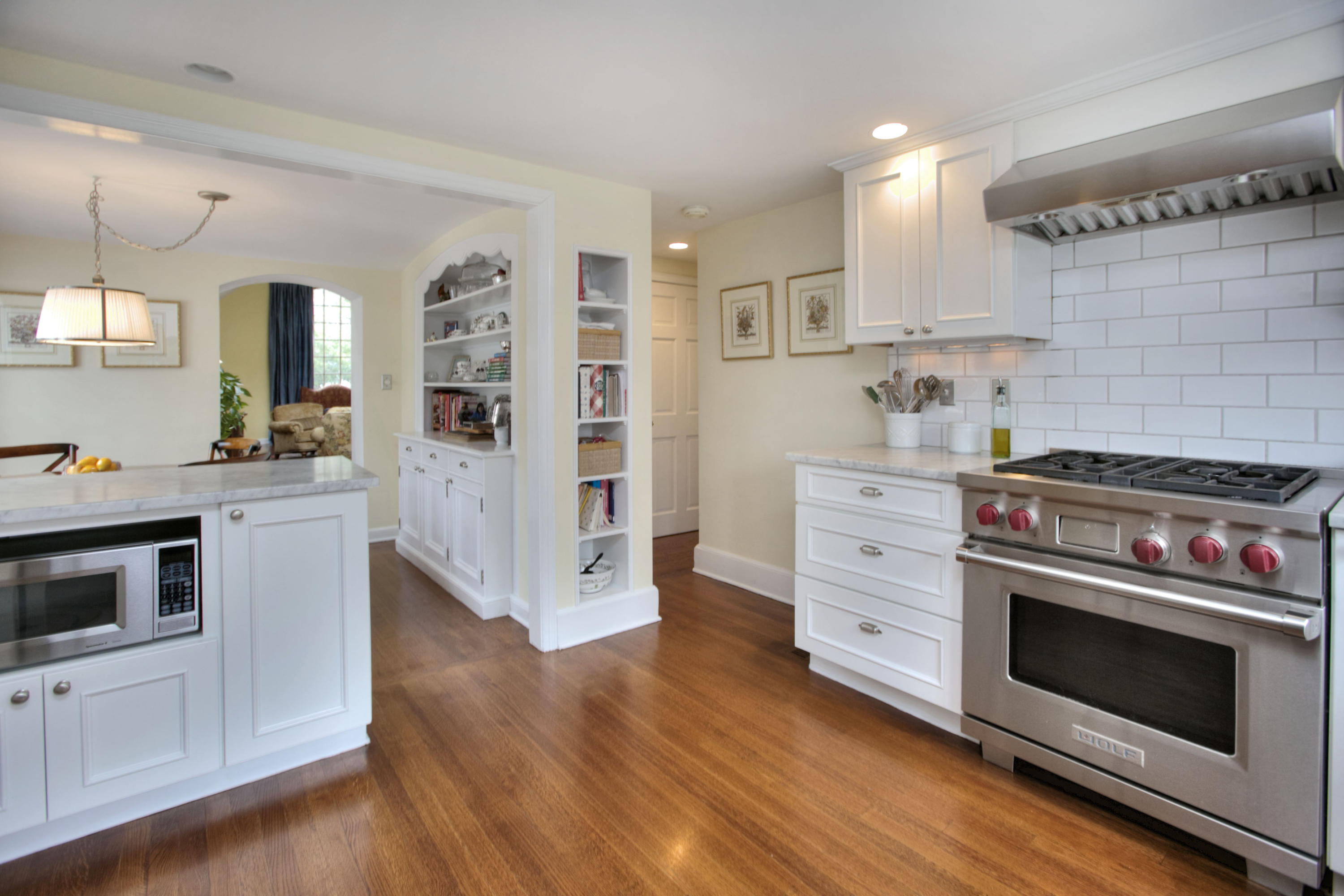 29 Stony Brook Road Darien, CT 06820 - Photo 10 of 24 a kitchen with stainless steel appliances a stove microwave and cabinets