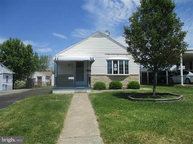 1717 Leslie Road Baltimore, MD 21222 - Photo 1 of 18 a front view of a house with a yard and garage