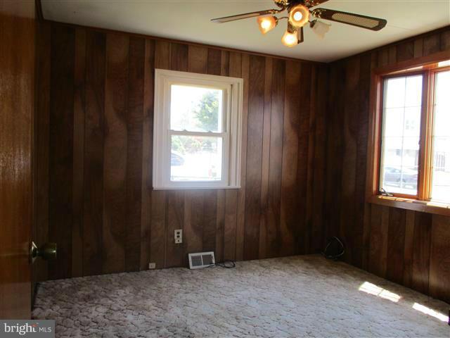 1717 Leslie Road Baltimore, MD 21222 - Photo 14 of 18 a view of an empty room with a window