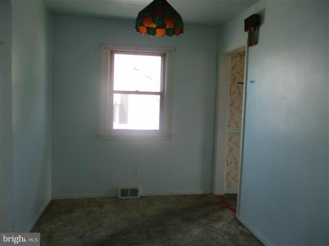 1717 Leslie Road Baltimore, MD 21222 - Photo 9 of 18 an empty room with a window