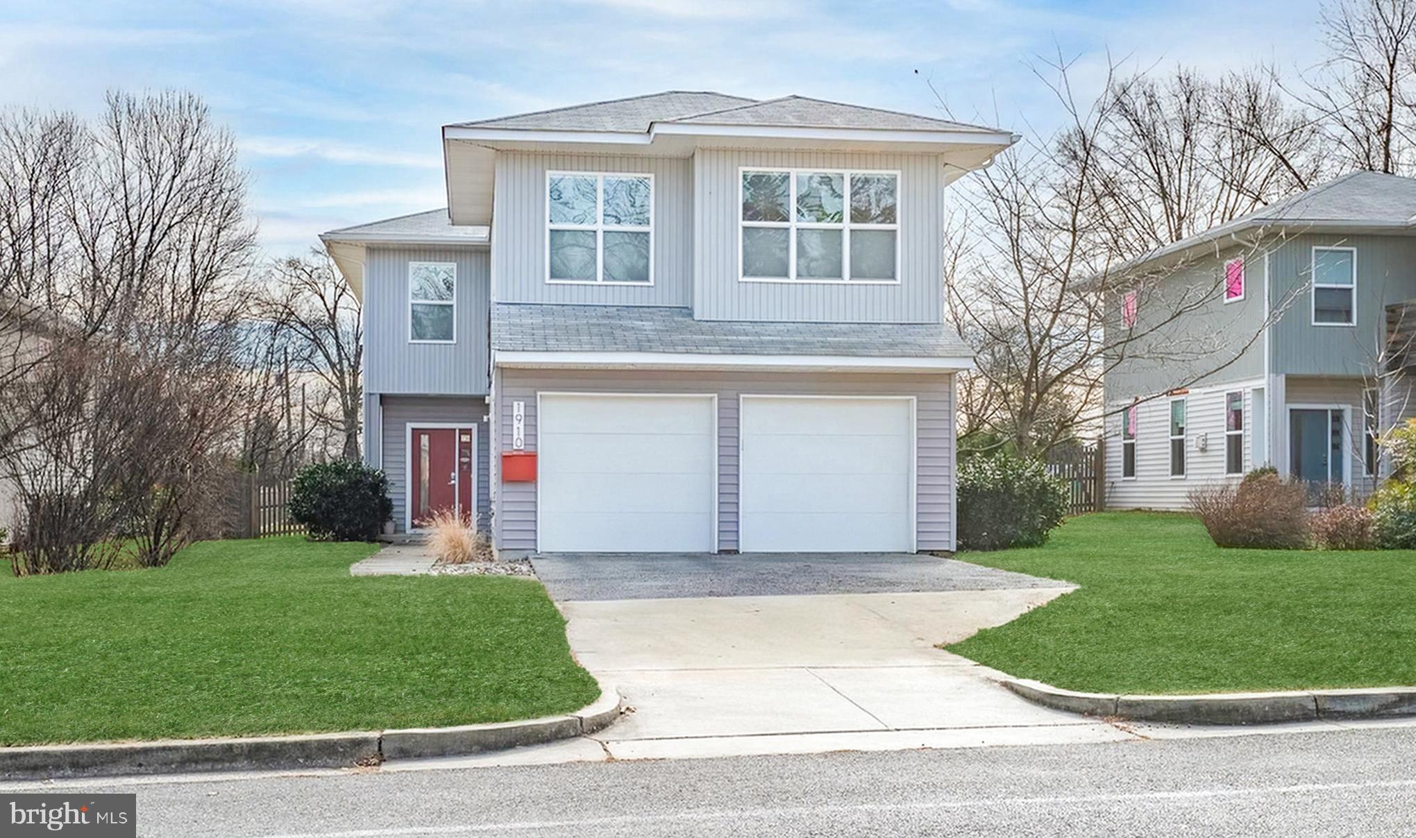 1910 Plyers Mill Road Silver Spring, MD 20902 - Photo 3 of 106 a front view of a house with a garden and plants