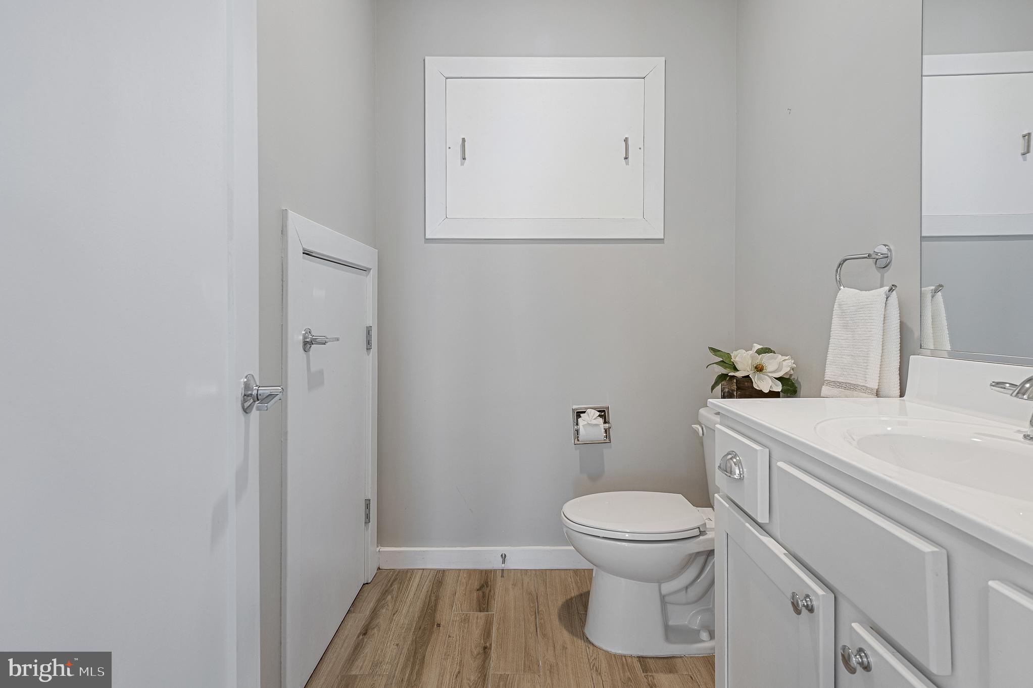 1910 Plyers Mill Road Silver Spring, MD 20902 - Photo 35 of 106 a bathroom with a toilet a sink and a window