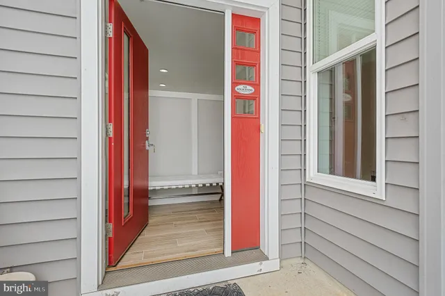 a view of room with workspace and wooden floor