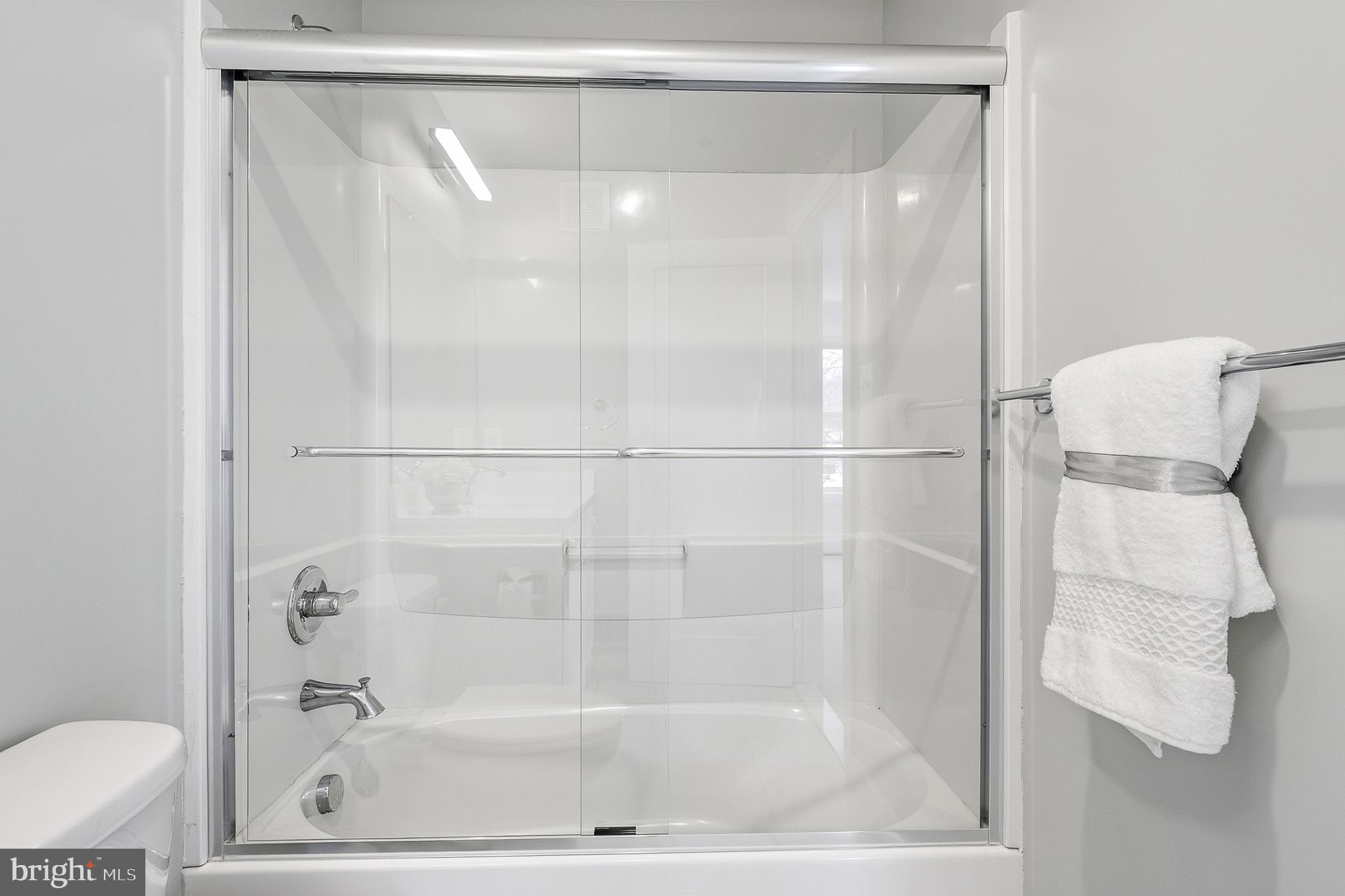 1910 Plyers Mill Road Silver Spring, MD 20902 - Photo 64 of 106 a bathroom with a shower and toilet