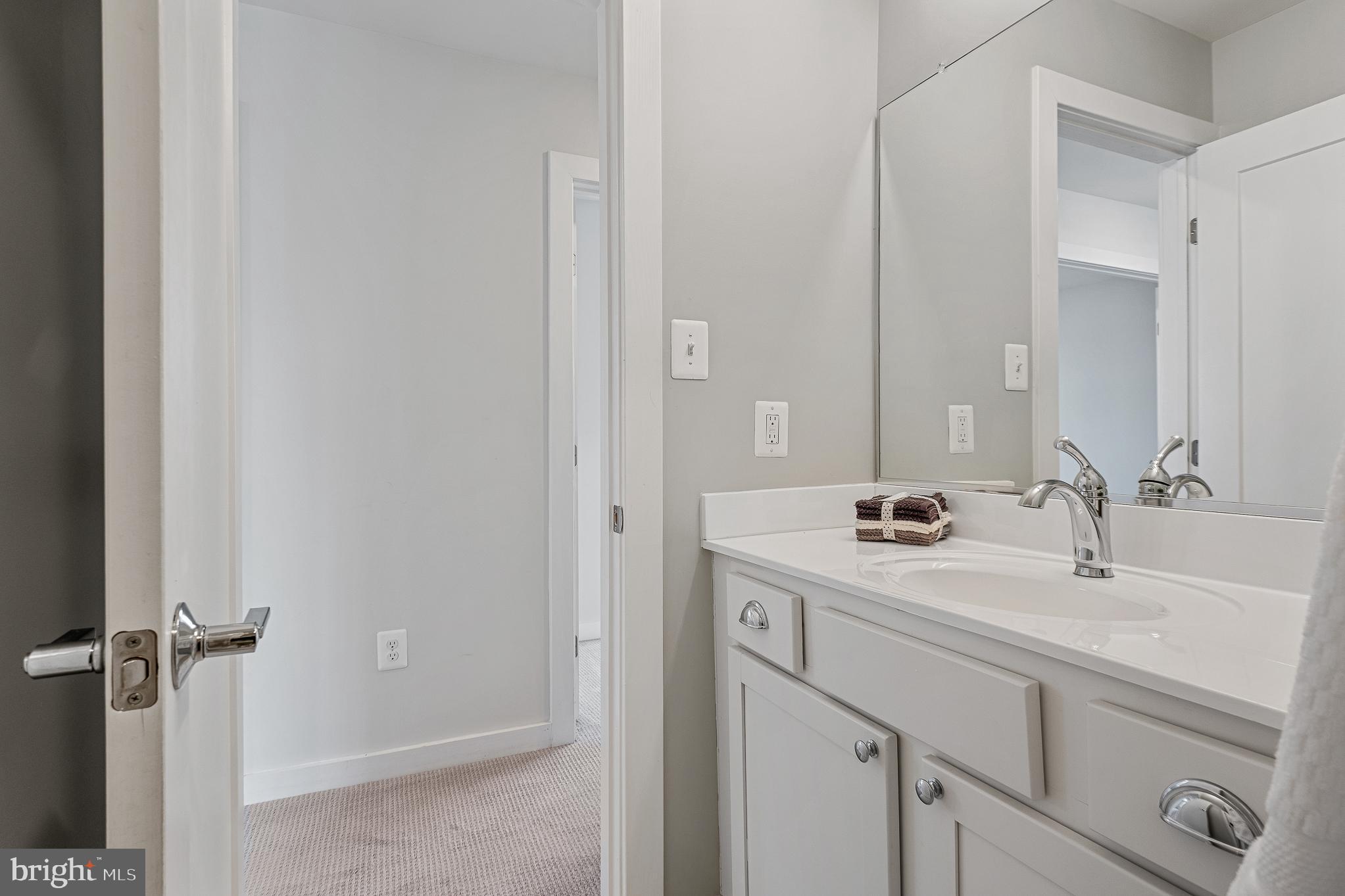 1910 Plyers Mill Road Silver Spring, MD 20902 - Photo 72 of 106 a bathroom with a sink and a mirror
