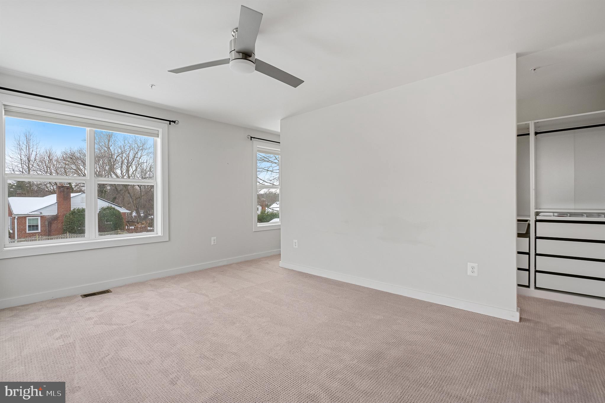 1910 Plyers Mill Road Silver Spring, MD 20902 - Photo 77 of 106 an empty room with windows and closet