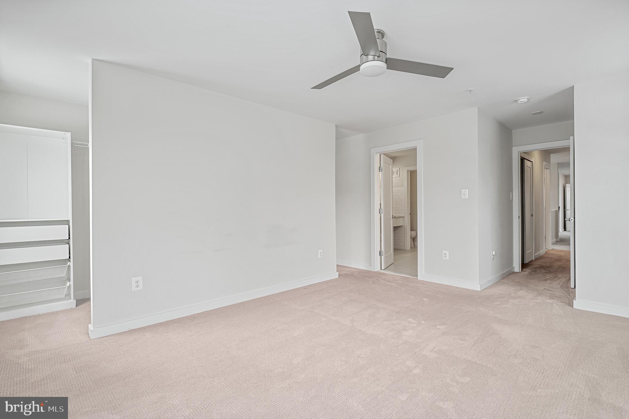 1910 Plyers Mill Road Silver Spring, MD 20902 - Photo 78 of 106 a view of an empty room and a ceiling fan