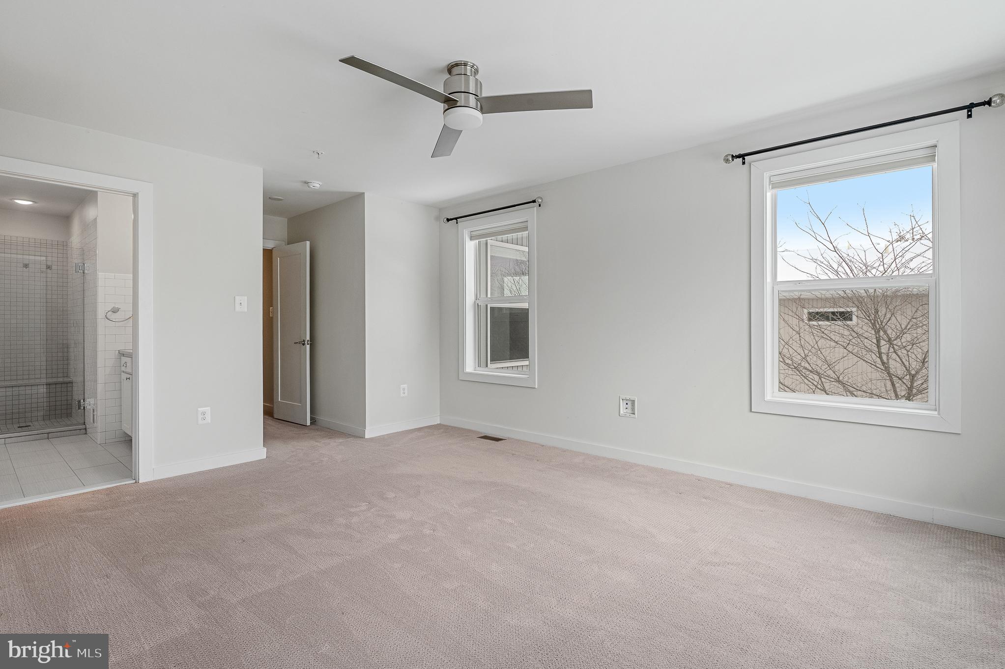 1910 Plyers Mill Road Silver Spring, MD 20902 - Photo 80 of 106 an empty room with windows and closet