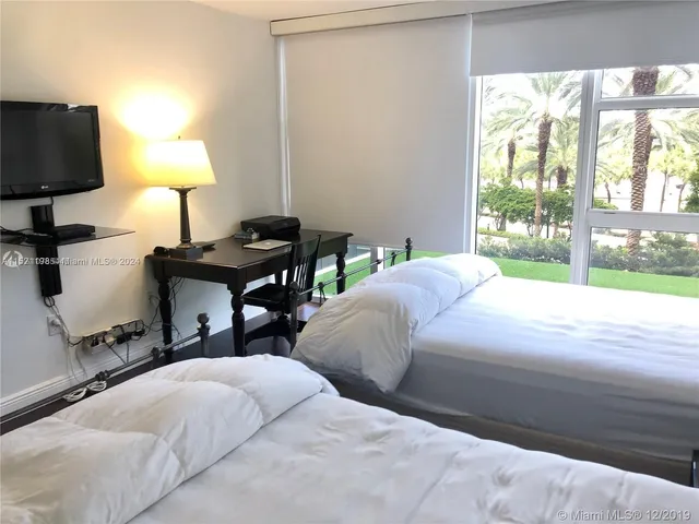 a bedroom with bed and a lamp