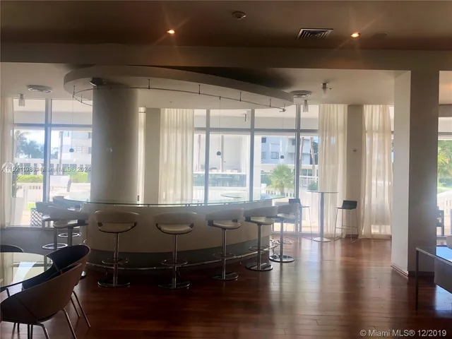 a room with furniture and wooden floor