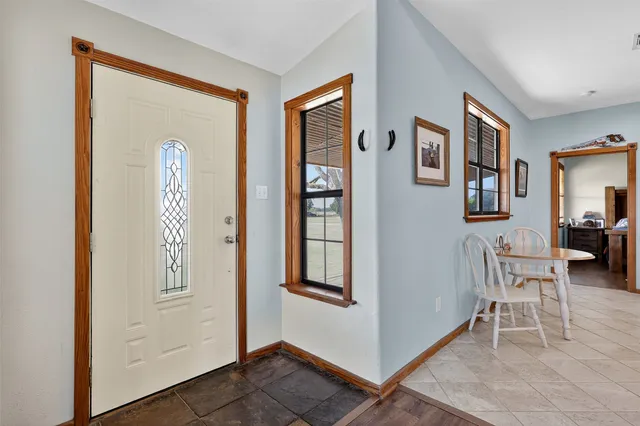 a view of livingroom with furniture and windows