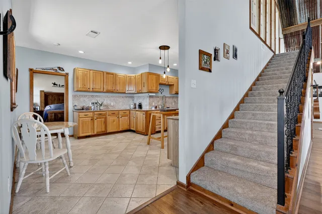 a view of kitchen with microwave and cabinets