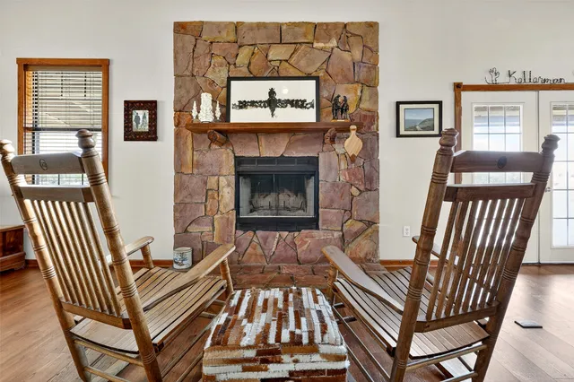 a view of a livingroom with furniture and a fireplace