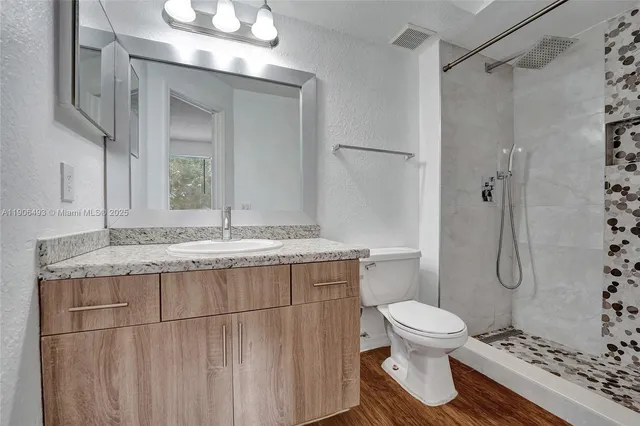 a view of a lake with houses in the background