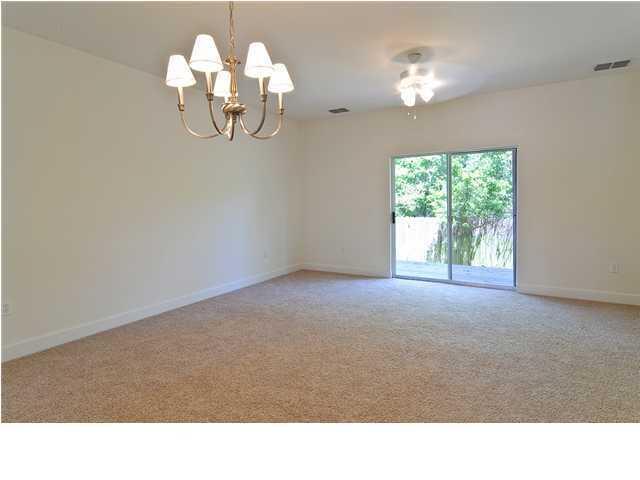 15284 331 Business, Unit 10D Freeport, FL 32439 - Photo 3 of 8 a open kitchen view with wooden floor and chandelier
