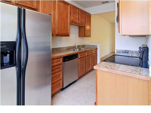 15284 331 Business, Unit 10D Freeport, FL 32439 - Photo 8 of 8 a kitchen with stainless steel appliances granite countertop a refrigerator and a stove