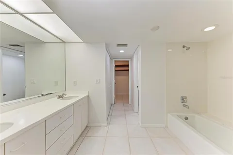 a spacious bathroom with a double vanity sink mirror and
