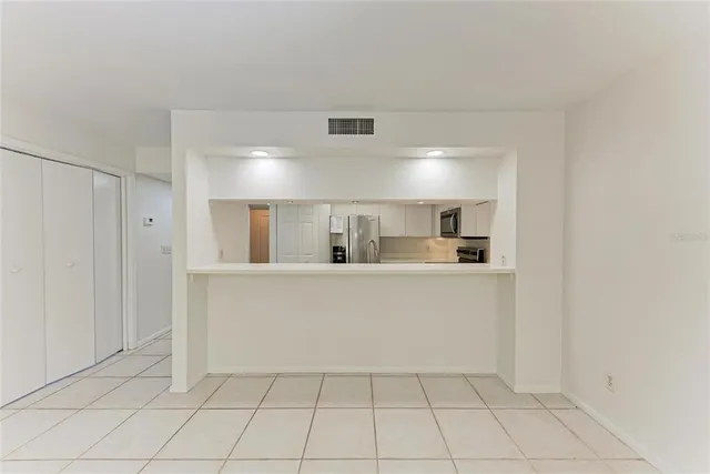 a view of kitchen with stainless steel appliances a refrigerator and a sink