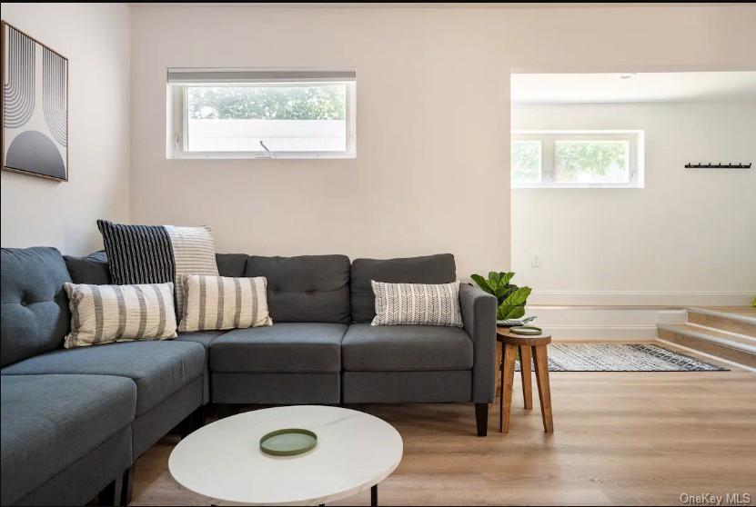 170 Beach 92nd Street Queens, NY 11693 - Photo 1 of 1 Living area with wood finished floors and plenty of natural light