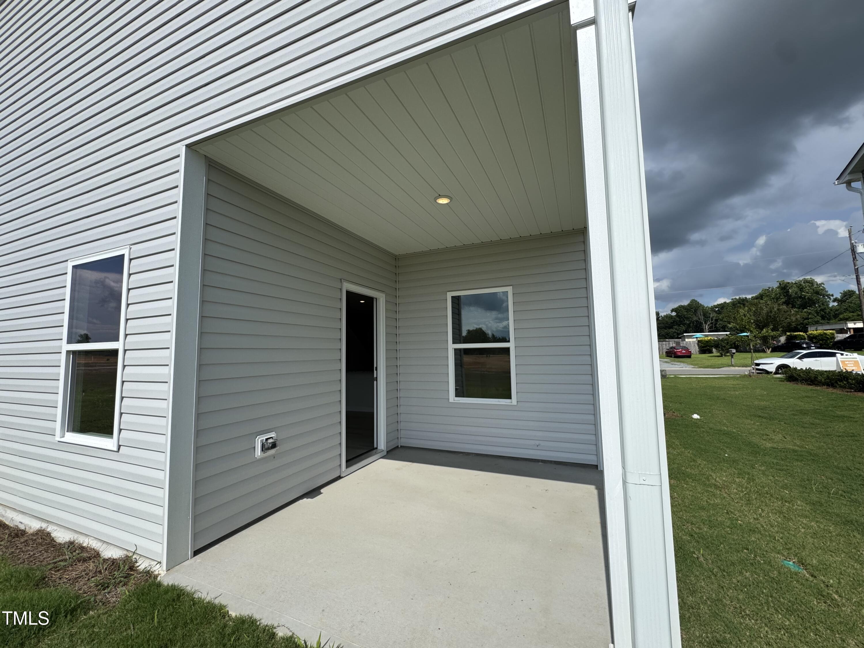184 Bruce Drive Dunn, NC 28334 - Photo 11 of 32 a back view of a house with a yard