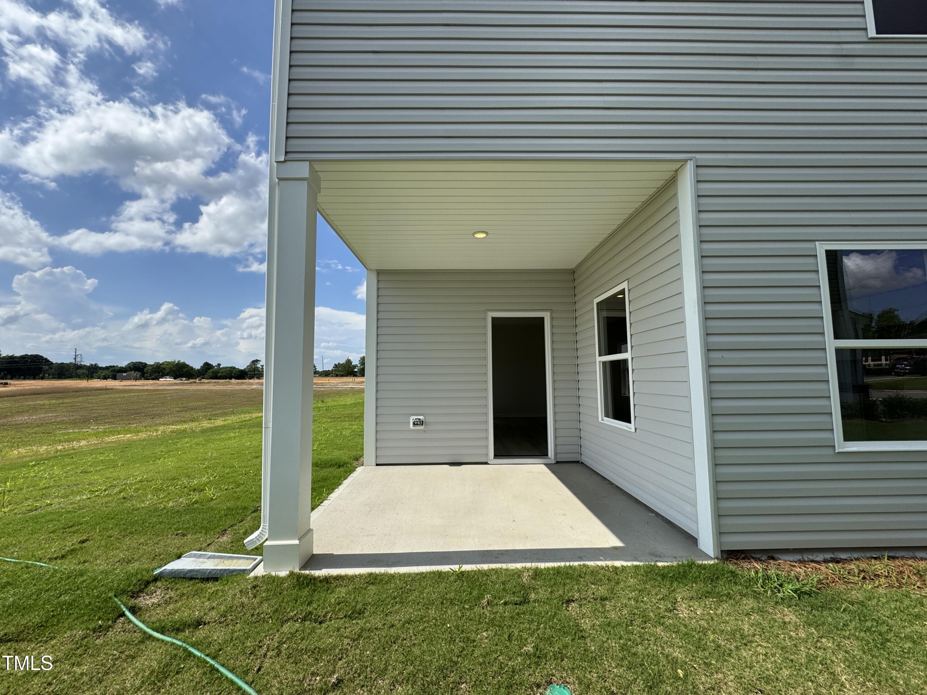 184 Bruce Drive Dunn, NC 28334 - Photo 12 of 32 a view of a backyard with plants and a patio