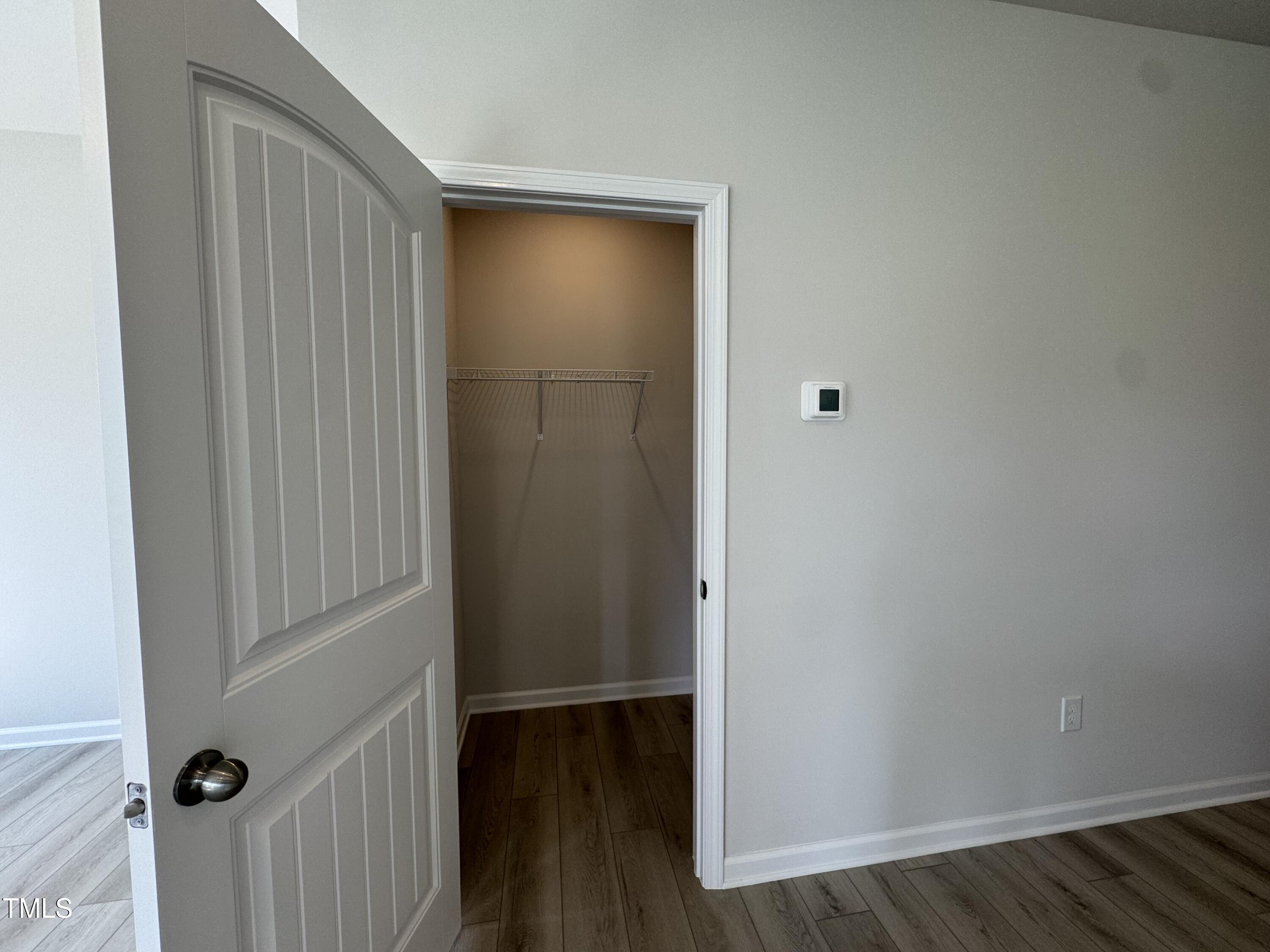 184 Bruce Drive Dunn, NC 28334 - Photo 13 of 32 a view of a hallway with wooden floor