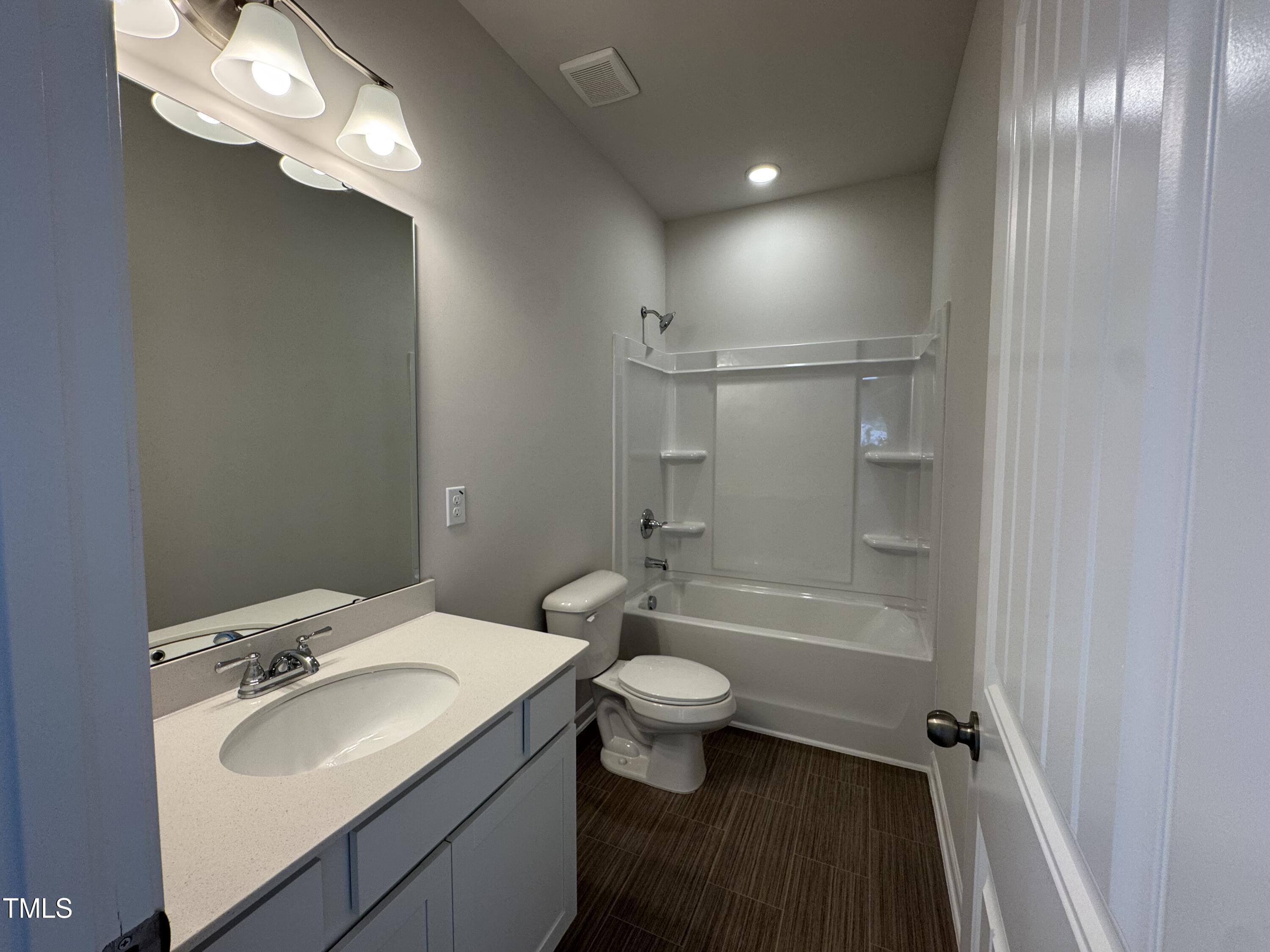 184 Bruce Drive Dunn, NC 28334 - Photo 15 of 32 a bathroom with a sink toilet tub and shower