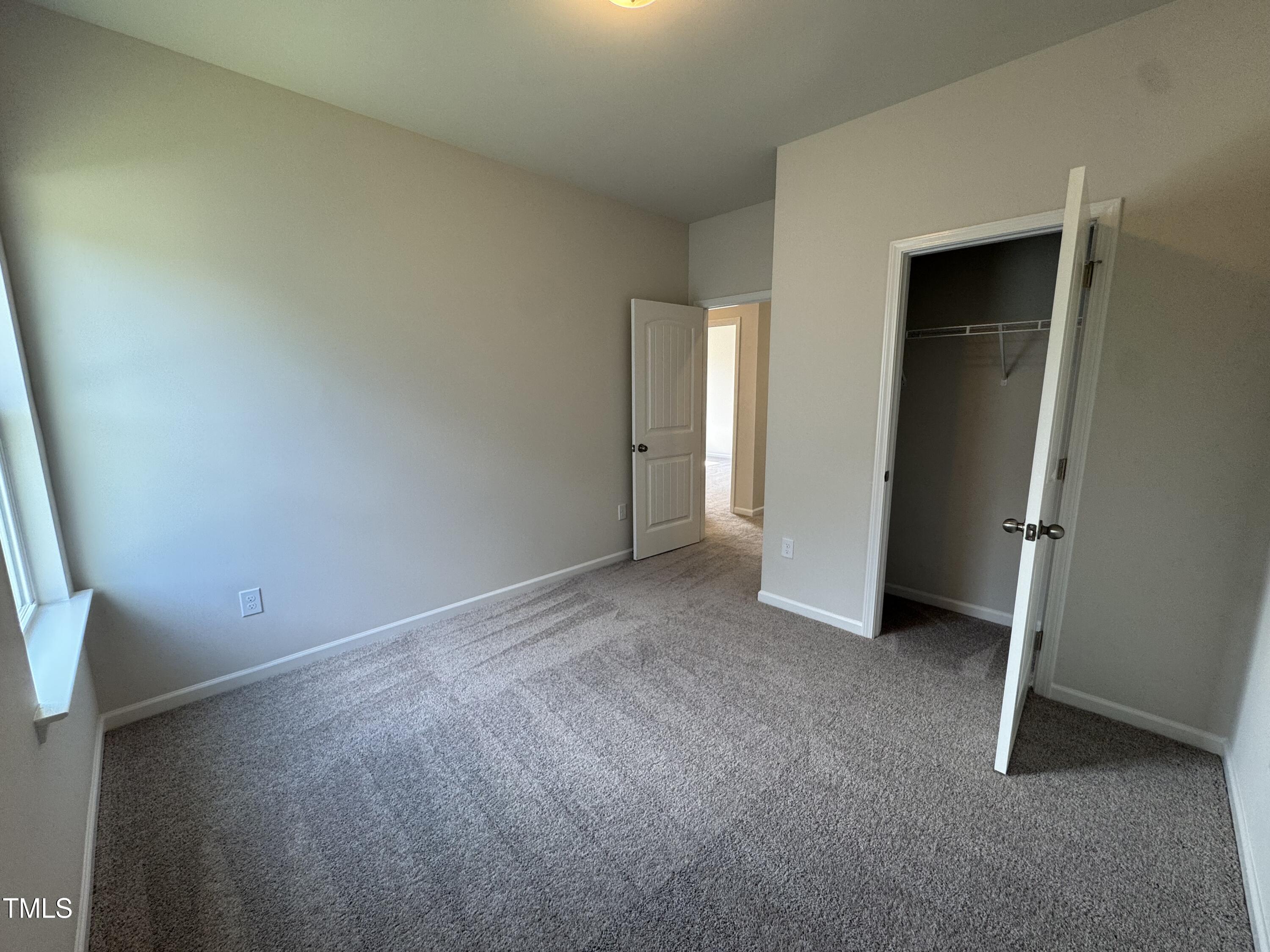 184 Bruce Drive Dunn, NC 28334 - Photo 19 of 32 an empty room with closet