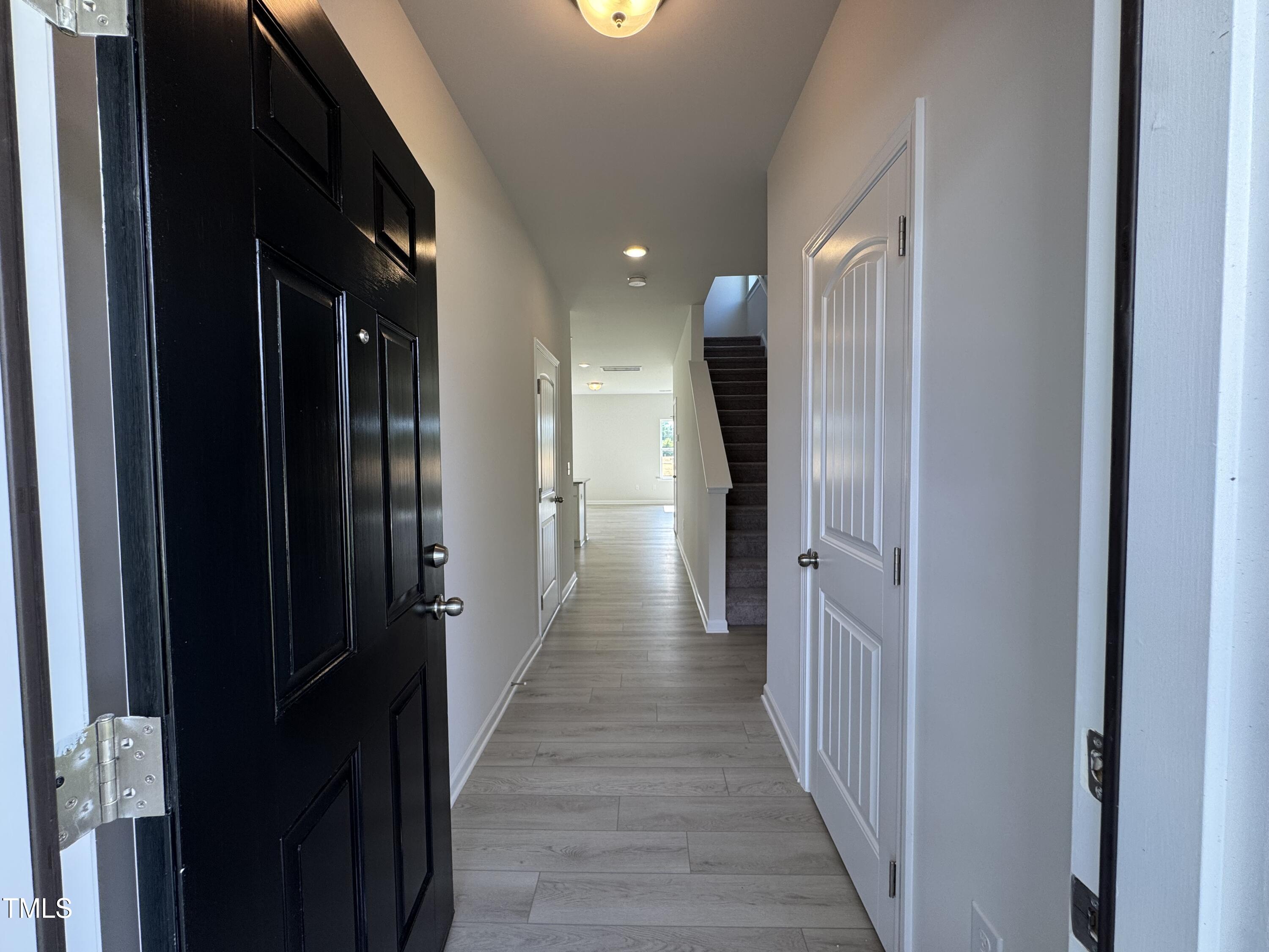 184 Bruce Drive Dunn, NC 28334 - Photo 2 of 32 a view of a hallway with wooden floor