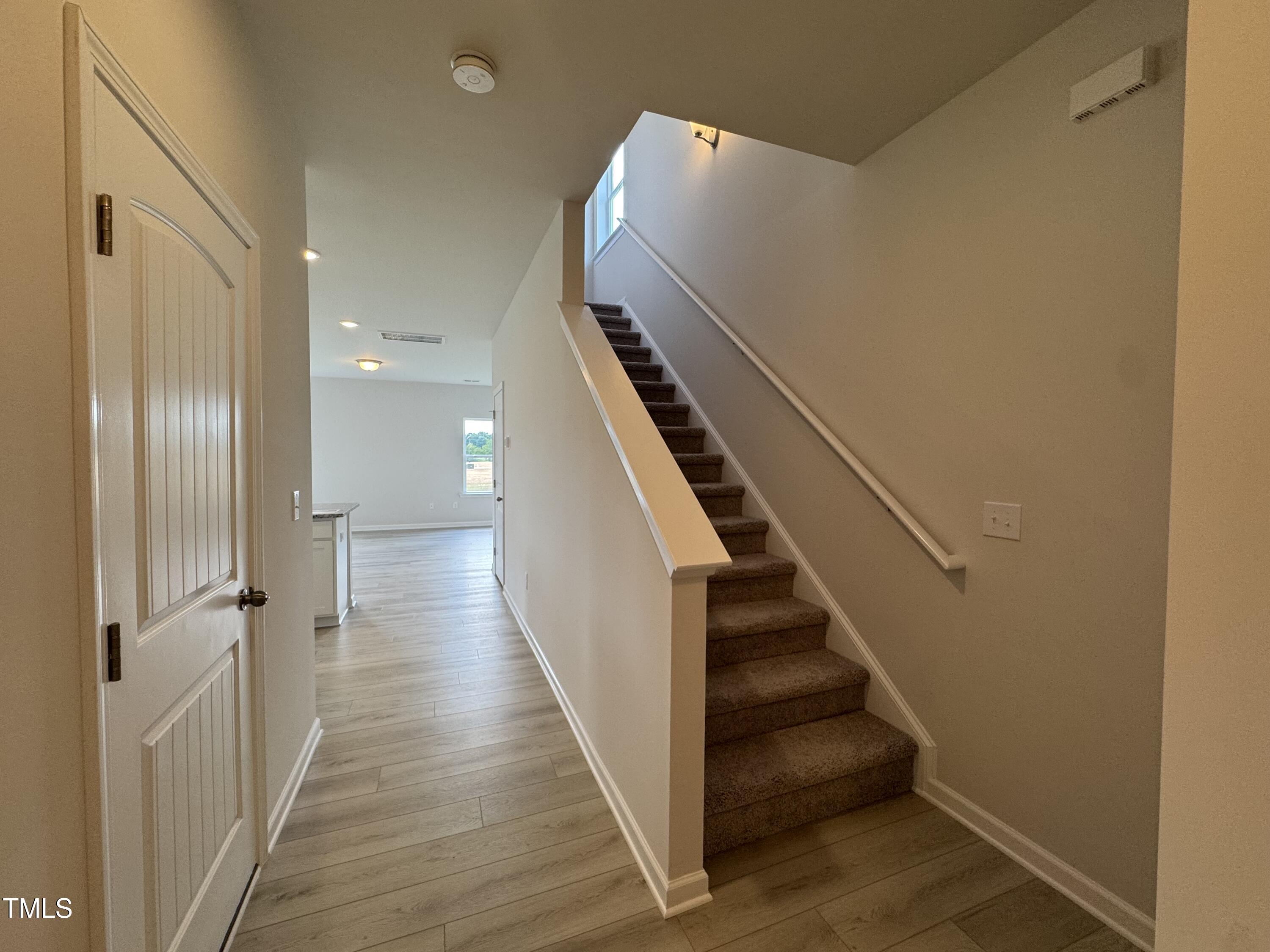 184 Bruce Drive Dunn, NC 28334 - Photo 3 of 32 a view of a hallway with wooden floor and entryway