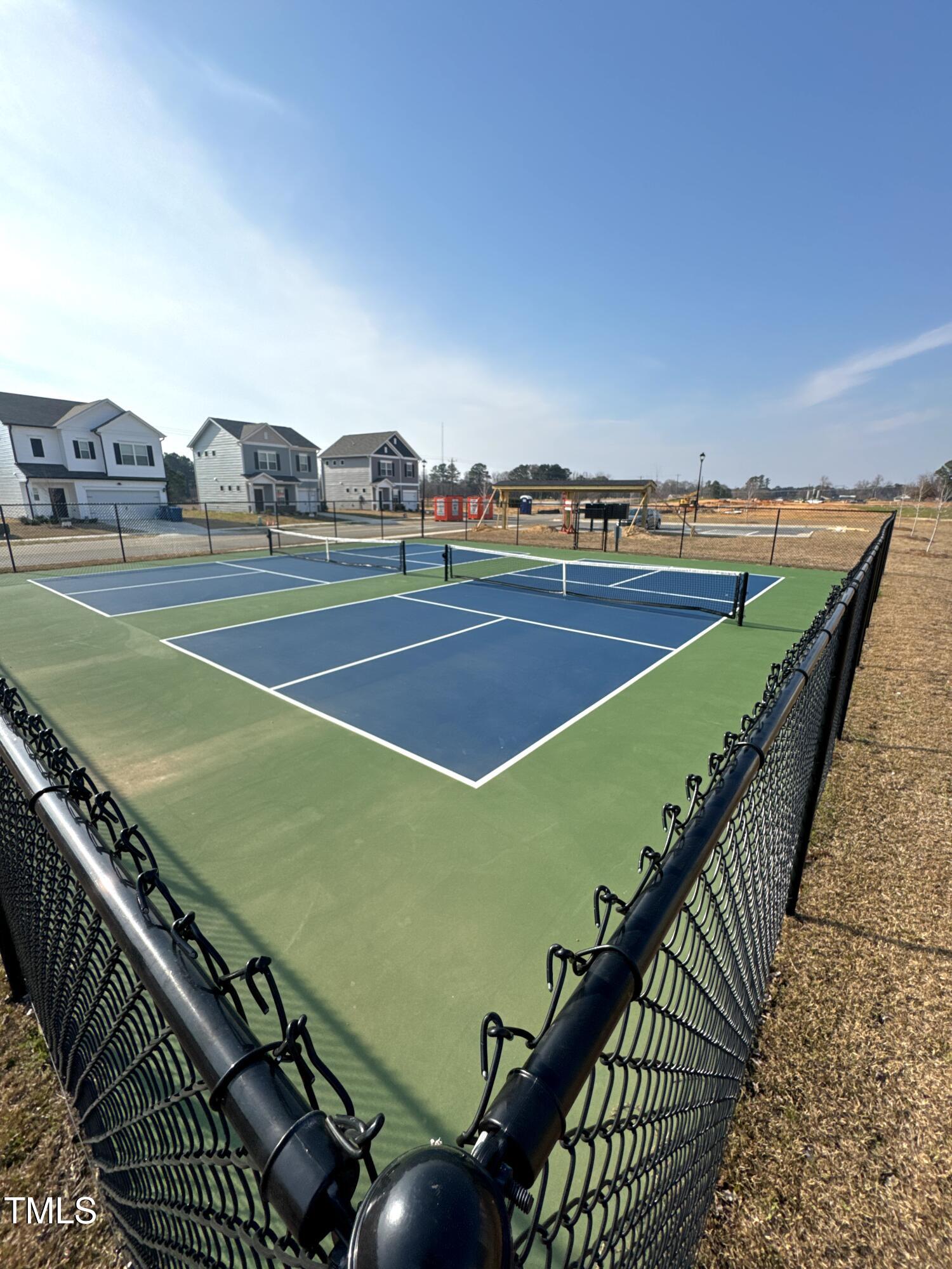 184 Bruce Drive Dunn, NC 28334 - Photo 31 of 32 a view of an outdoor space and tennis court