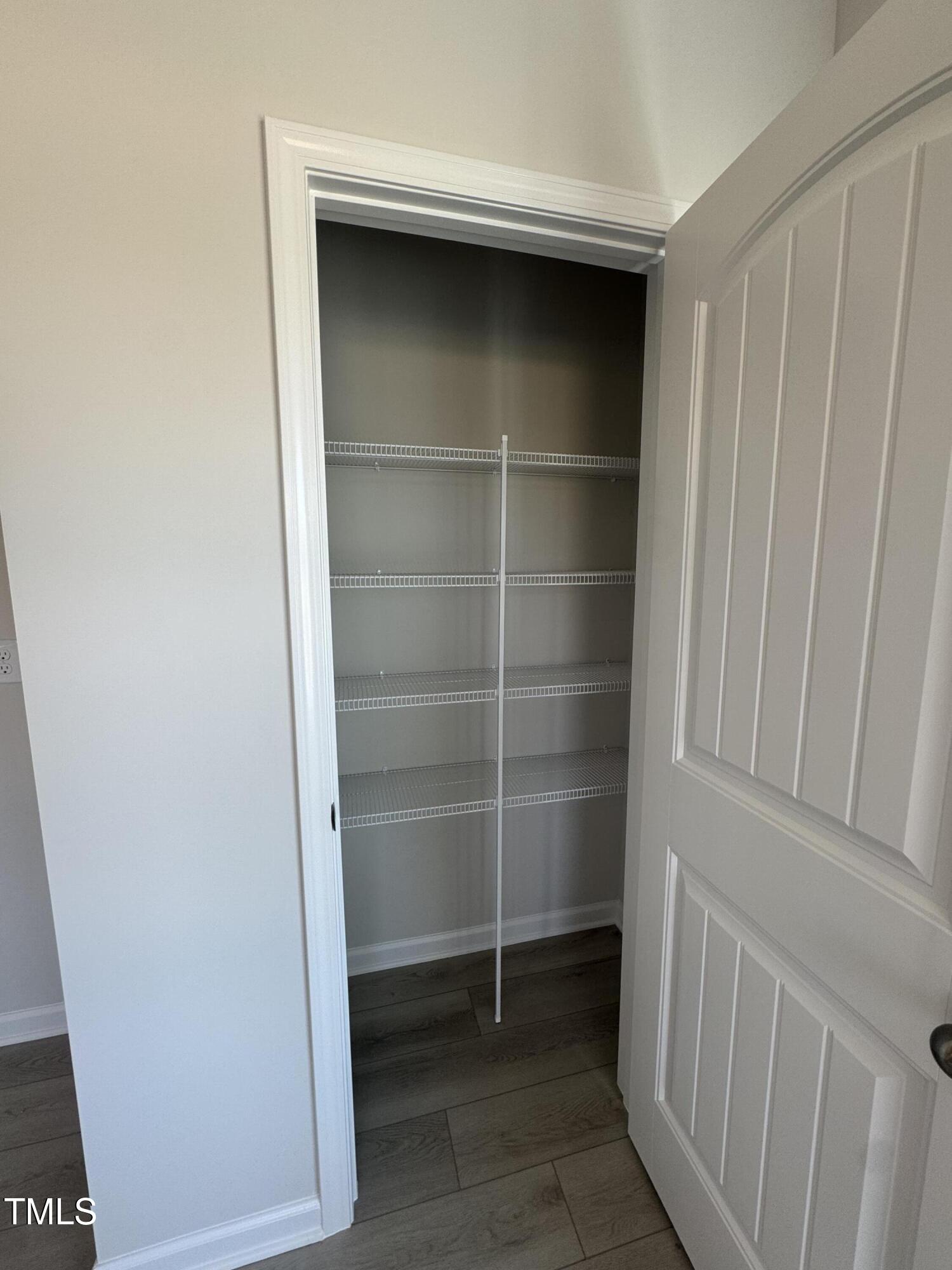 184 Bruce Drive Dunn, NC 28334 - Photo 10 of 32 a view of walk in closet with empty racks
