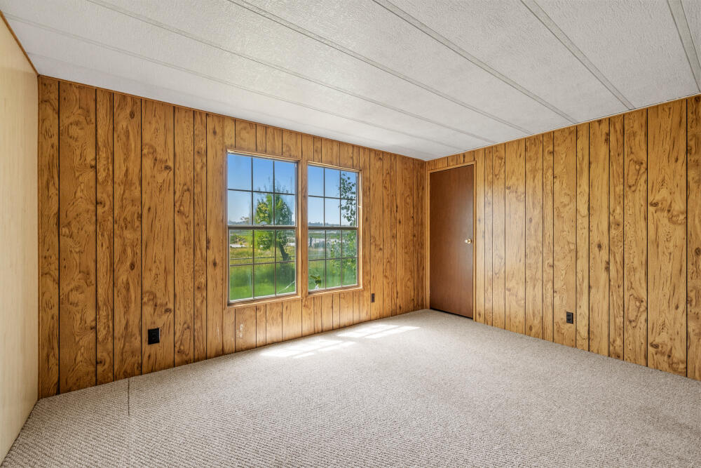 31410 Union Street Bonanza, OR 97623 - Photo 17 of 37 a view of an empty room with a window and balcony