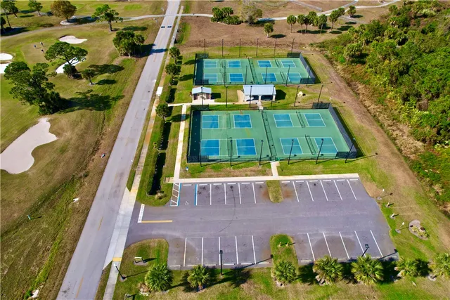 an aerial view of a house with a swimming pool