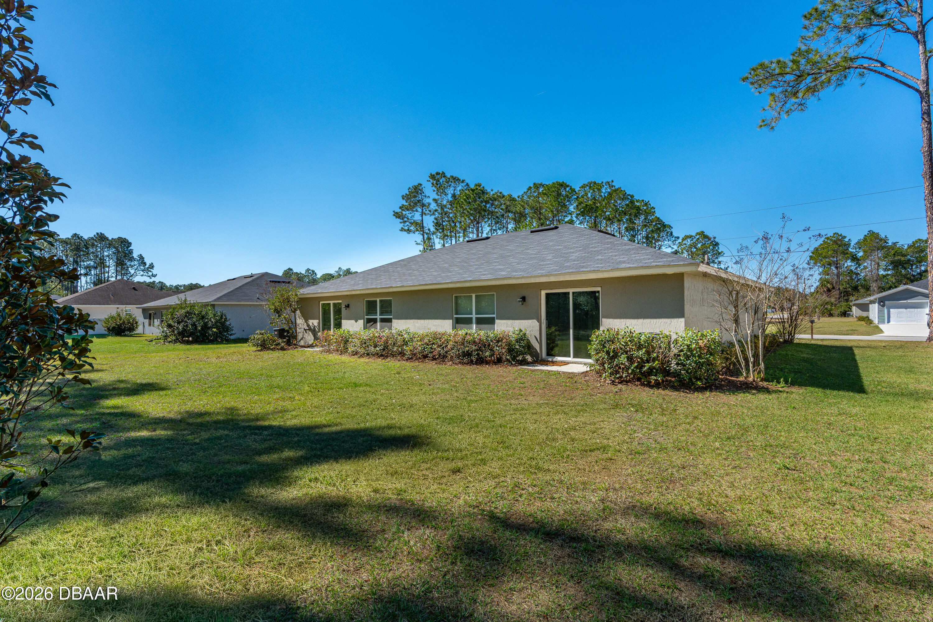 2 Union Court Palm Coast, FL 32164 - Photo 11 of 42 a front view of a house with garden