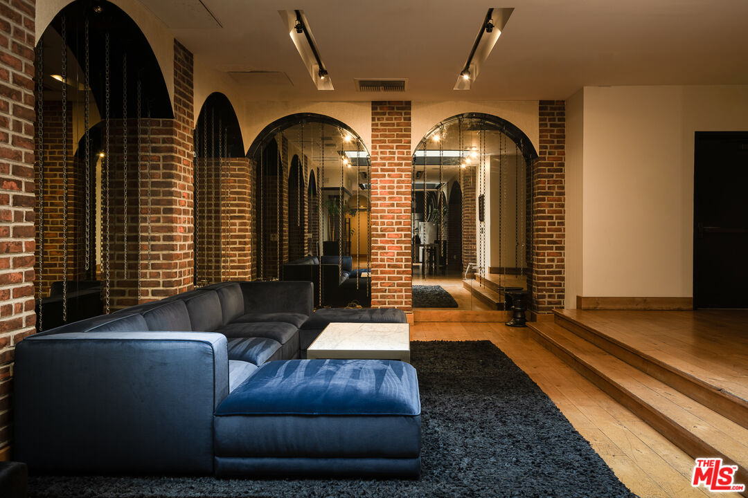 460 South Spring Street, Unit 1015 Los Angeles, CA 90013 - Photo 43 of 50 a living room with furniture and large windows