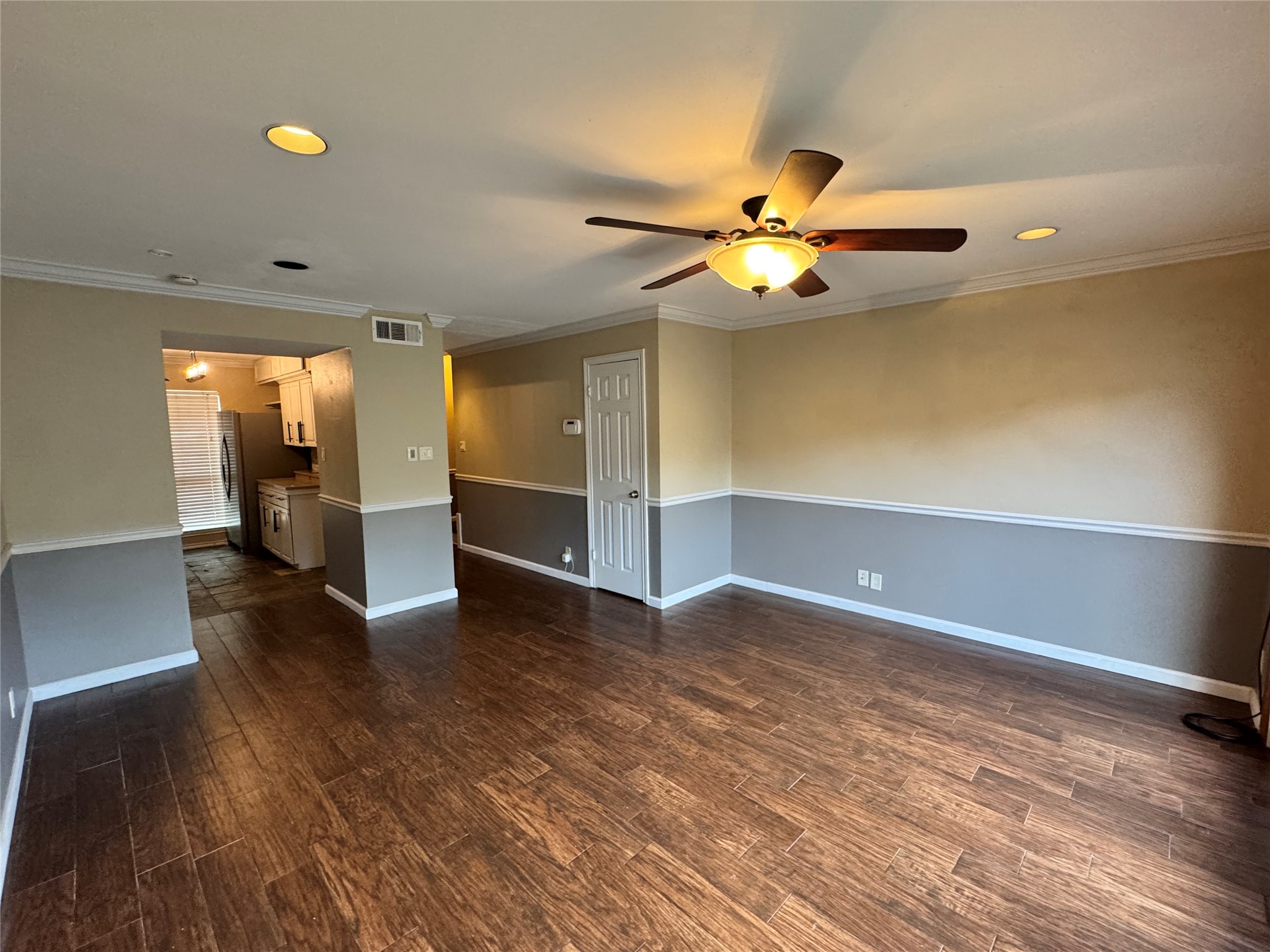 2041 Winrock Boulevard, Unit 157 Houston, TX 77057 - Photo 3 of 25 Spacious living with natural light from a wall of windows and French doors overlooking the private patio.