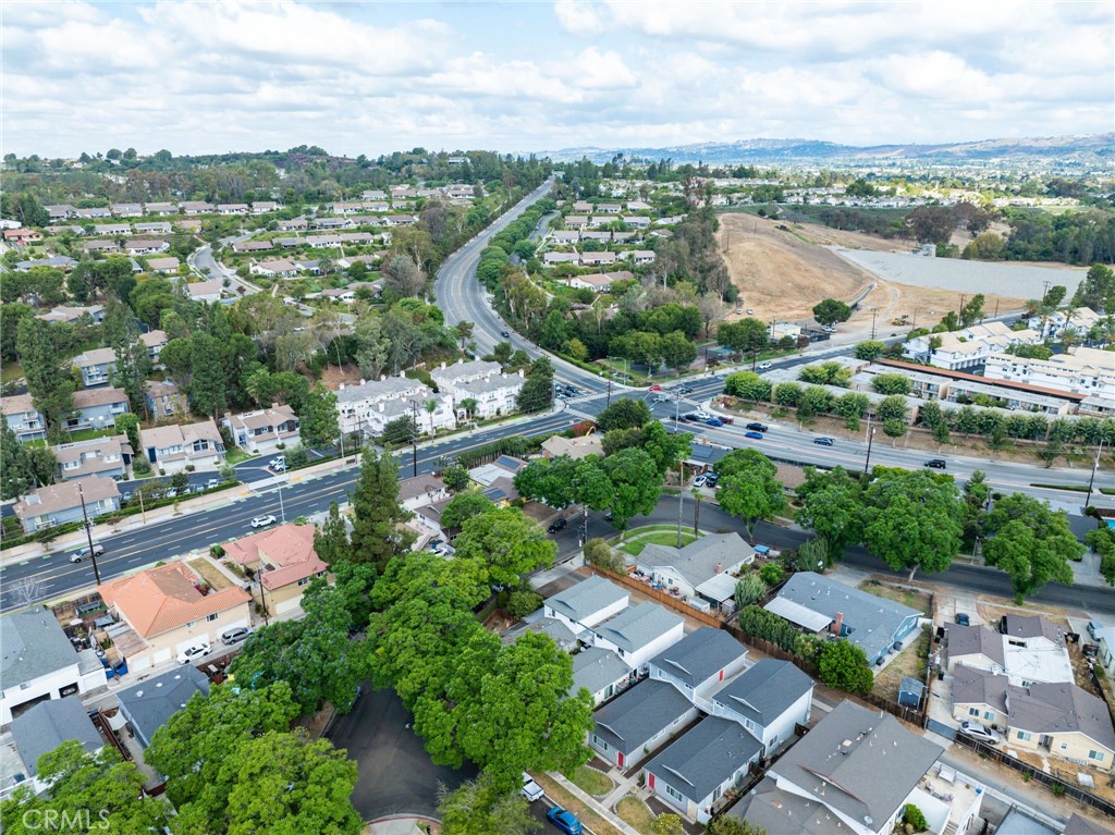 2601 Andover Avenue Fullerton, CA 92831 - Photo 12 of 14 an aerial view of a city with lots of residential buildings ocean and mountain view in back