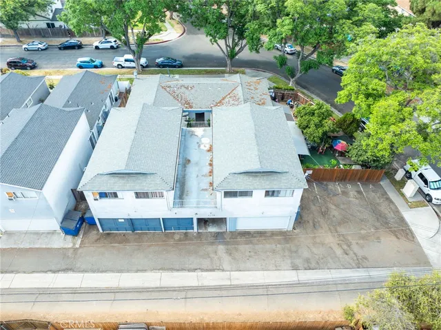 an aerial view of a house with outdoor space