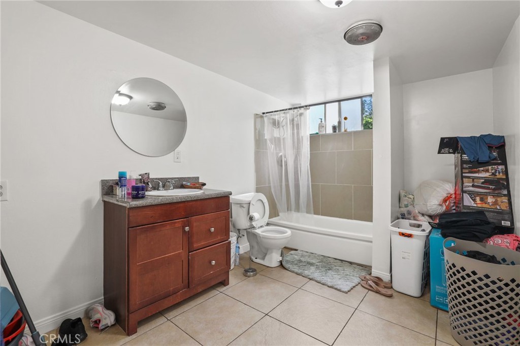 2601 Andover Avenue Fullerton, CA 92831 - Photo 8 of 14 a bathroom with a sink toilet and a mirror